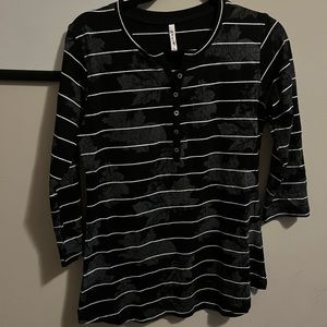 Black top with white stripes and maple leaf details.